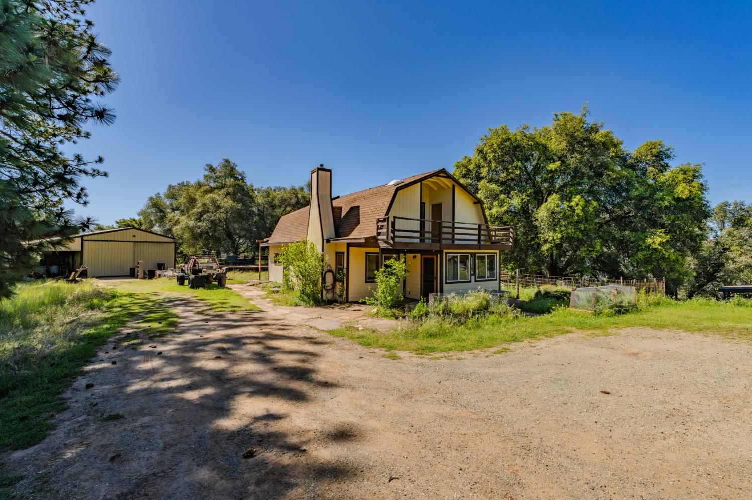 17800 Red Mule Road Fiddletown, CA 95629 - Photo 32 of 74 a view of a house with a yard and a large tree