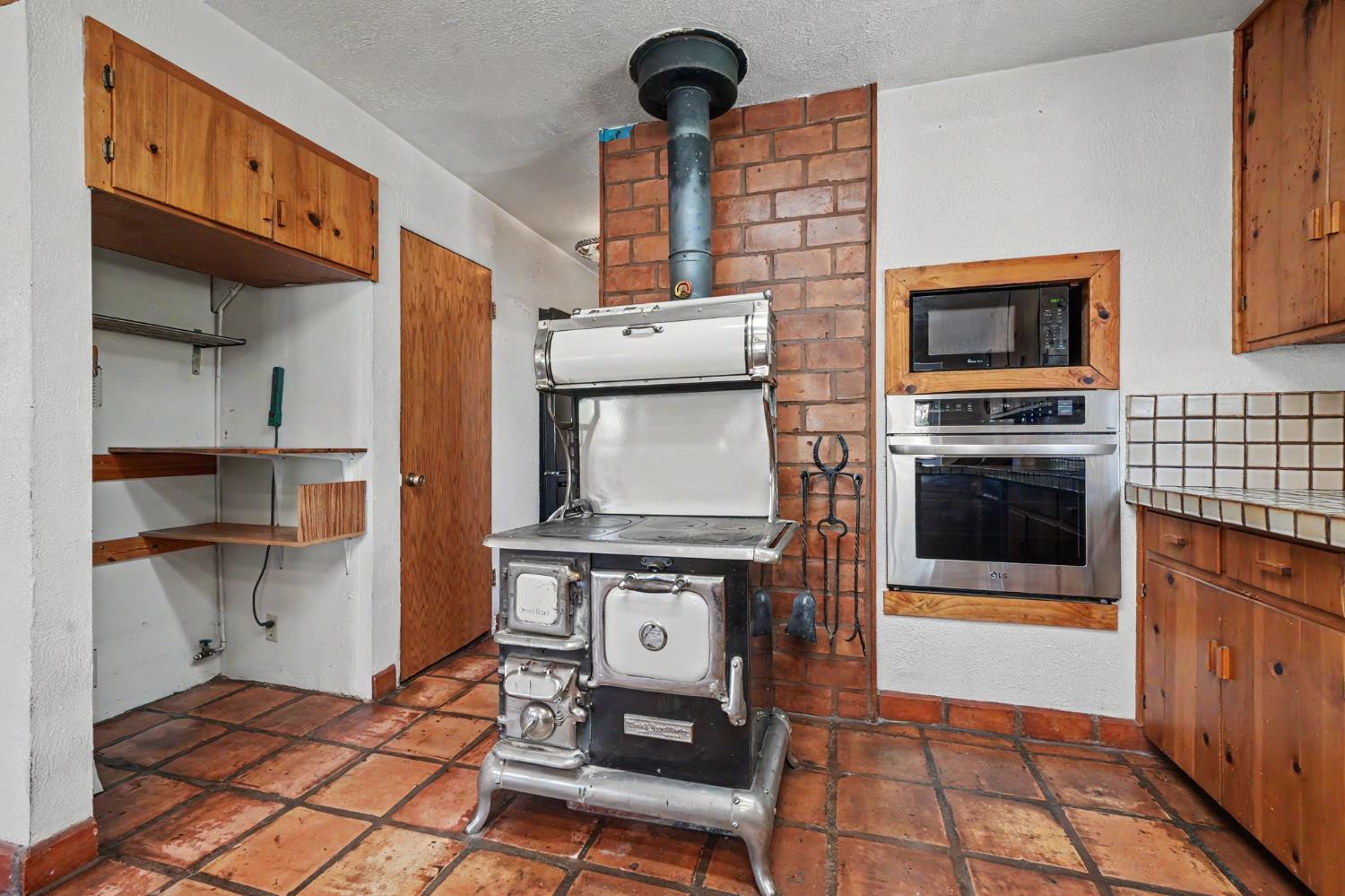 17800 Red Mule Road Fiddletown, CA 95629 - Photo 8 of 74 a view of a kitchen with fridge and stove