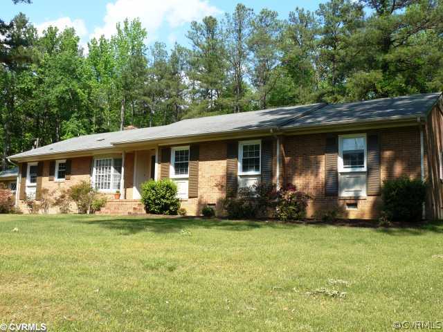 7101 Belmont Road Chesterfield, VA 23832 - Photo 1 of 12 a front view of house with yard and green space
