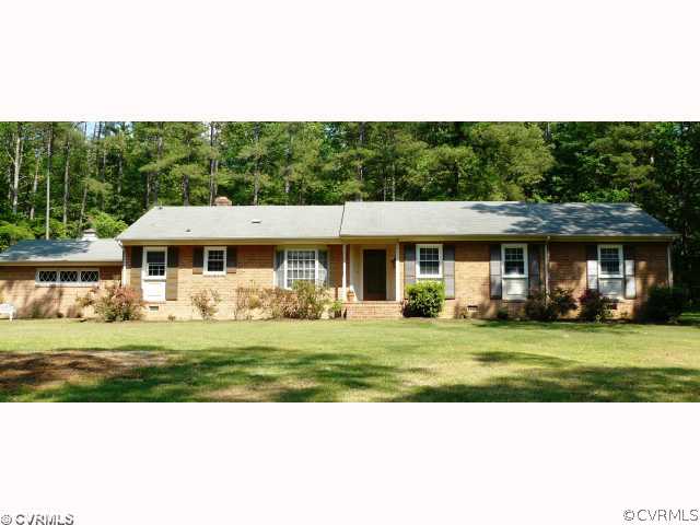 7101 Belmont Road Chesterfield, VA 23832 - Photo 2 of 12 a front view of a house with a garden