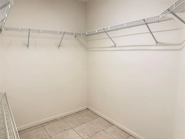 a bathroom that has a glass shower door