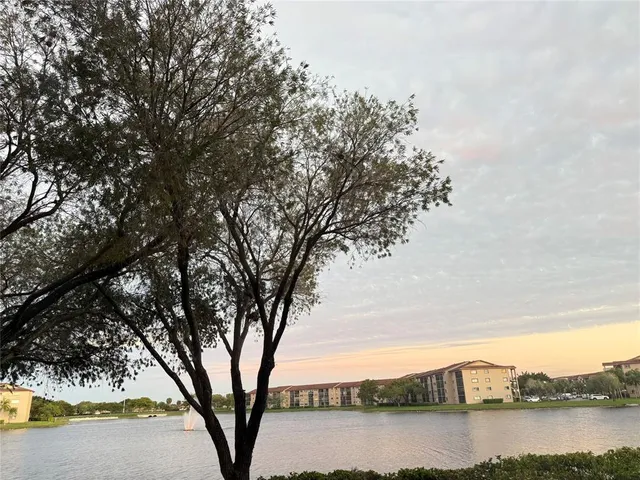 a view of a room that has a bed in it