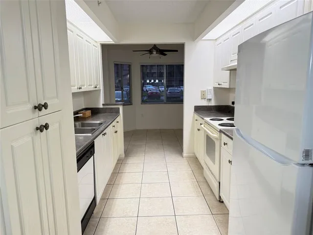 a kitchen with stainless steel appliances a stove and a refrigerator