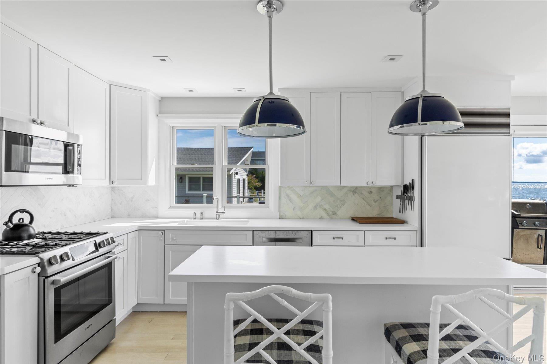 4415 Camp Mineola Road Mattituck, NY 11952 - Photo 8 of 44 Custom designed kitchen boasting top amenities and additional prep space.