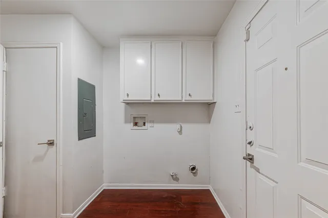 a view of cabinets and wooden floor