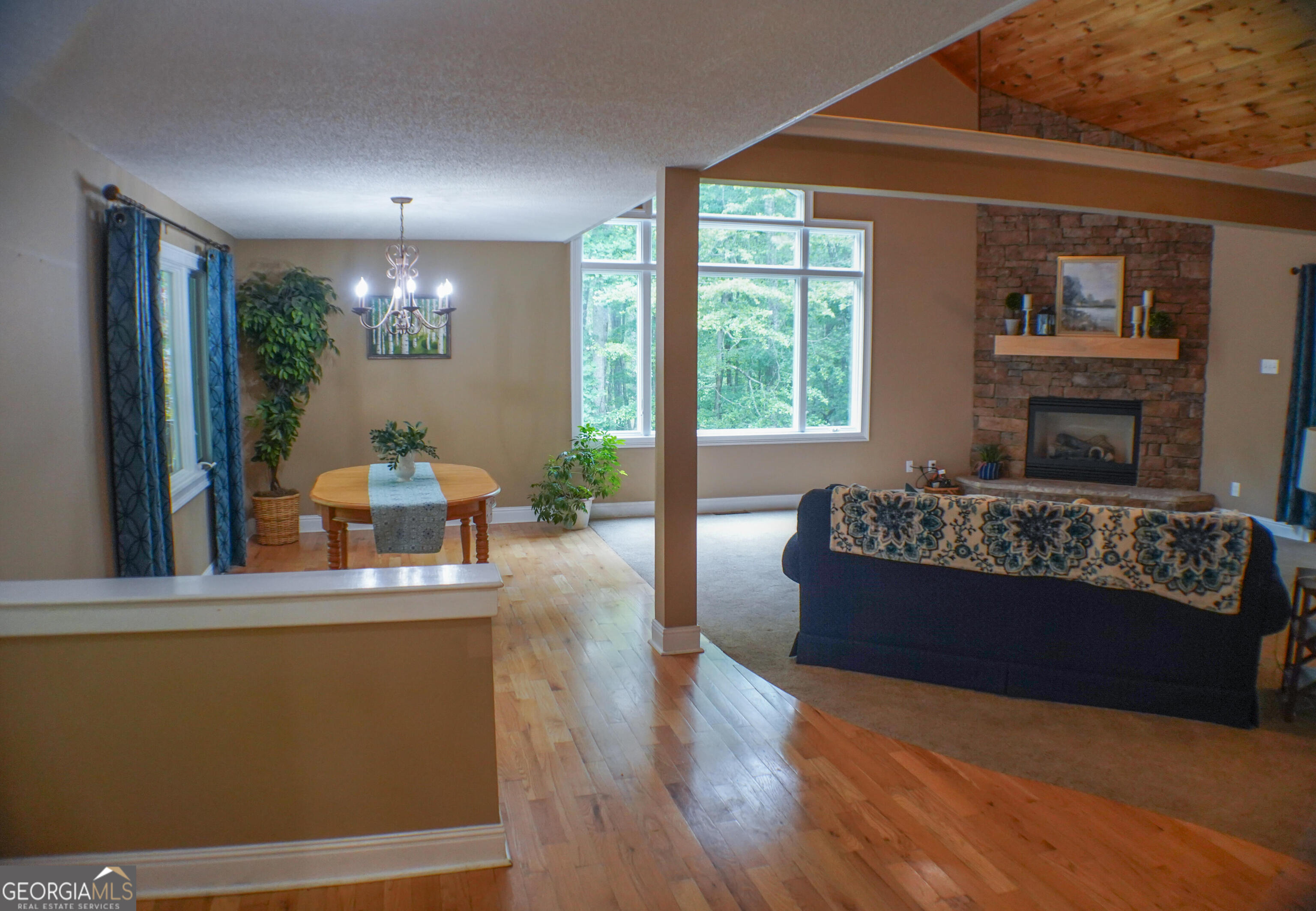 335 Winding Stream Trail Hampton, GA 30228 - Photo 6 of 35 a living room with furniture and a large window