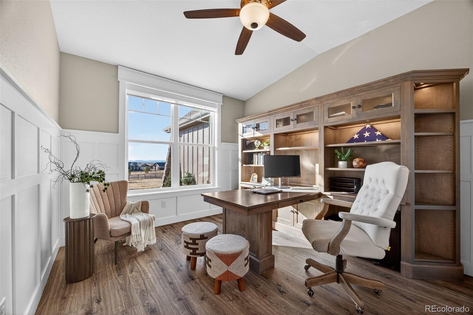 3444 Antelope Ridge Trail Parker, CO 80138 - Photo 11 of 50 a living room with furniture and a flat screen tv