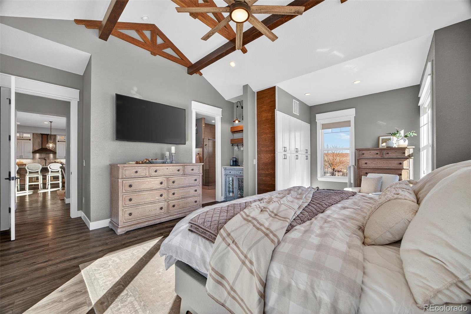 3444 Antelope Ridge Trail Parker, CO 80138 - Photo 20 of 50 a bedroom with a bed and a flat screen tv