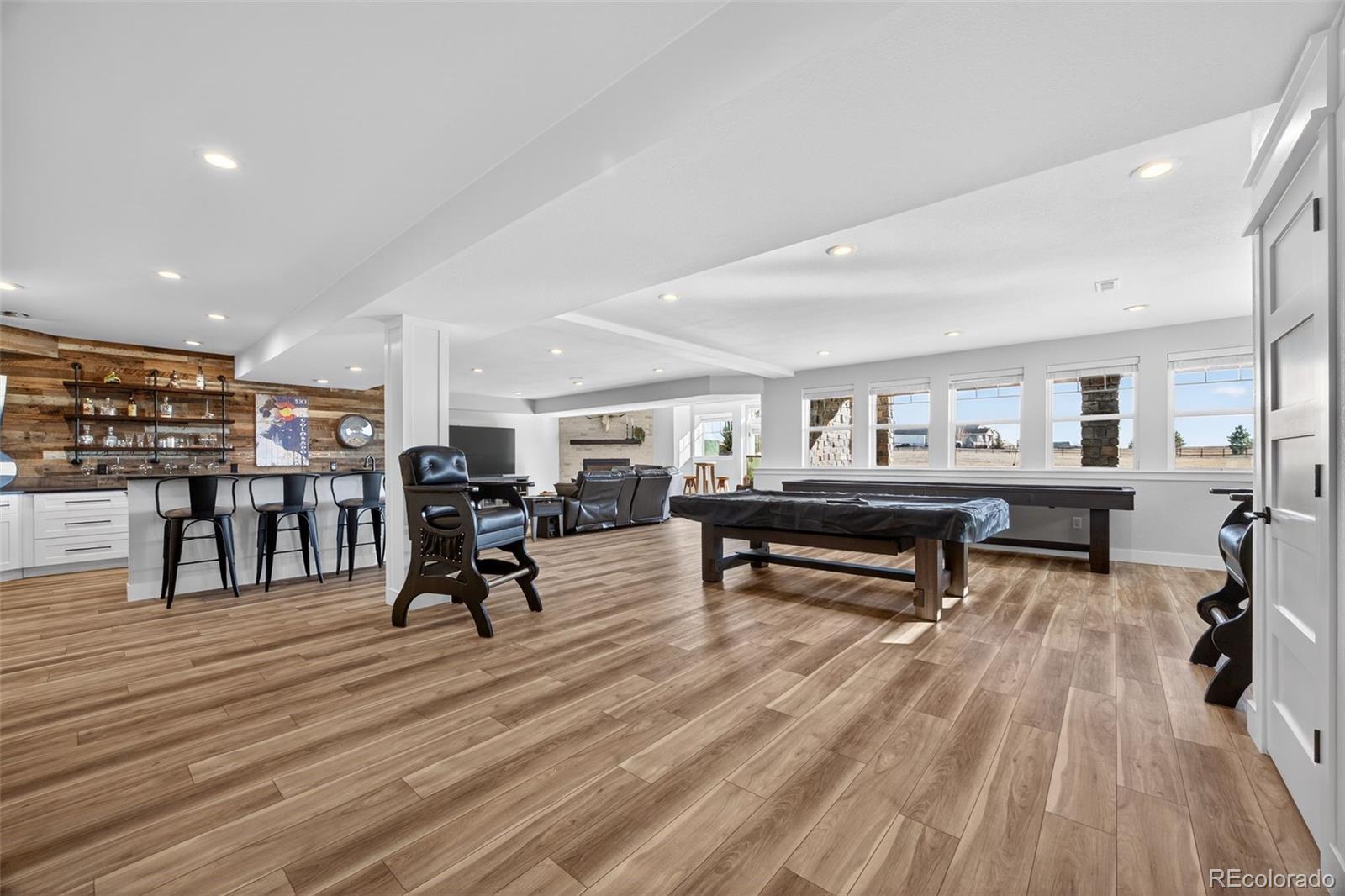 3444 Antelope Ridge Trail Parker, CO 80138 - Photo 30 of 50 a living room filled with furniture and a wooden floor