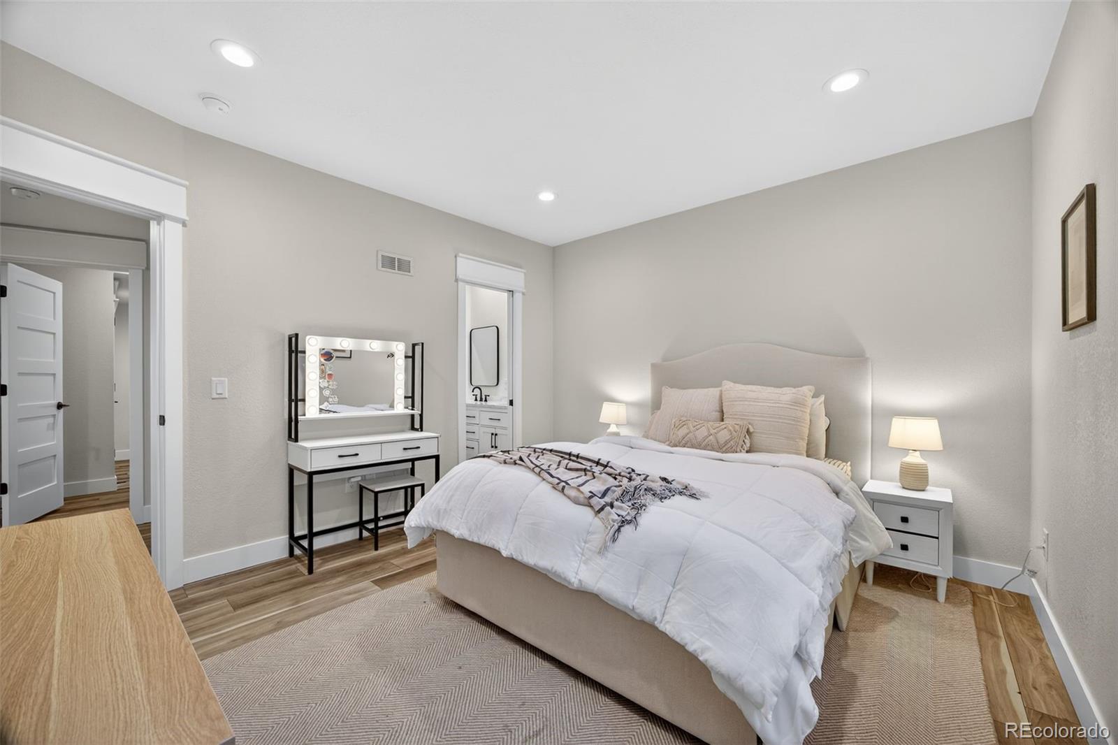 3444 Antelope Ridge Trail Parker, CO 80138 - Photo 35 of 50 a bedroom with a bed and a table