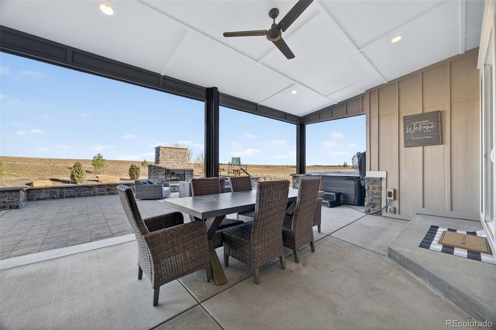 3444 Antelope Ridge Trail Parker, CO 80138 - Photo 39 of 50 a dining room with furniture and a floor to ceiling window