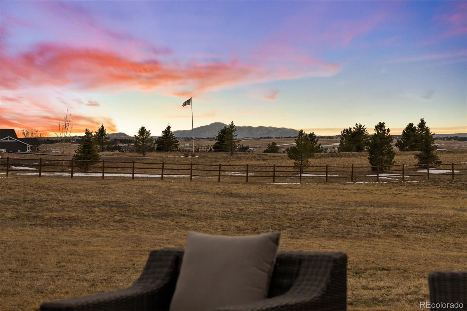 3444 Antelope Ridge Trail Parker, CO 80138 - Photo 40 of 50 a view of a lake with a big yard