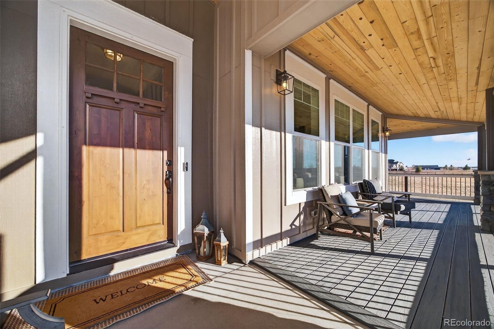 3444 Antelope Ridge Trail Parker, CO 80138 - Photo 5 of 50 a living room with furniture and large windows