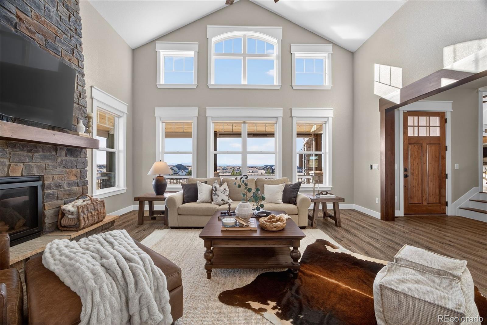 3444 Antelope Ridge Trail Parker, CO 80138 - Photo 9 of 50 a living room with furniture fireplace and flat screen tv