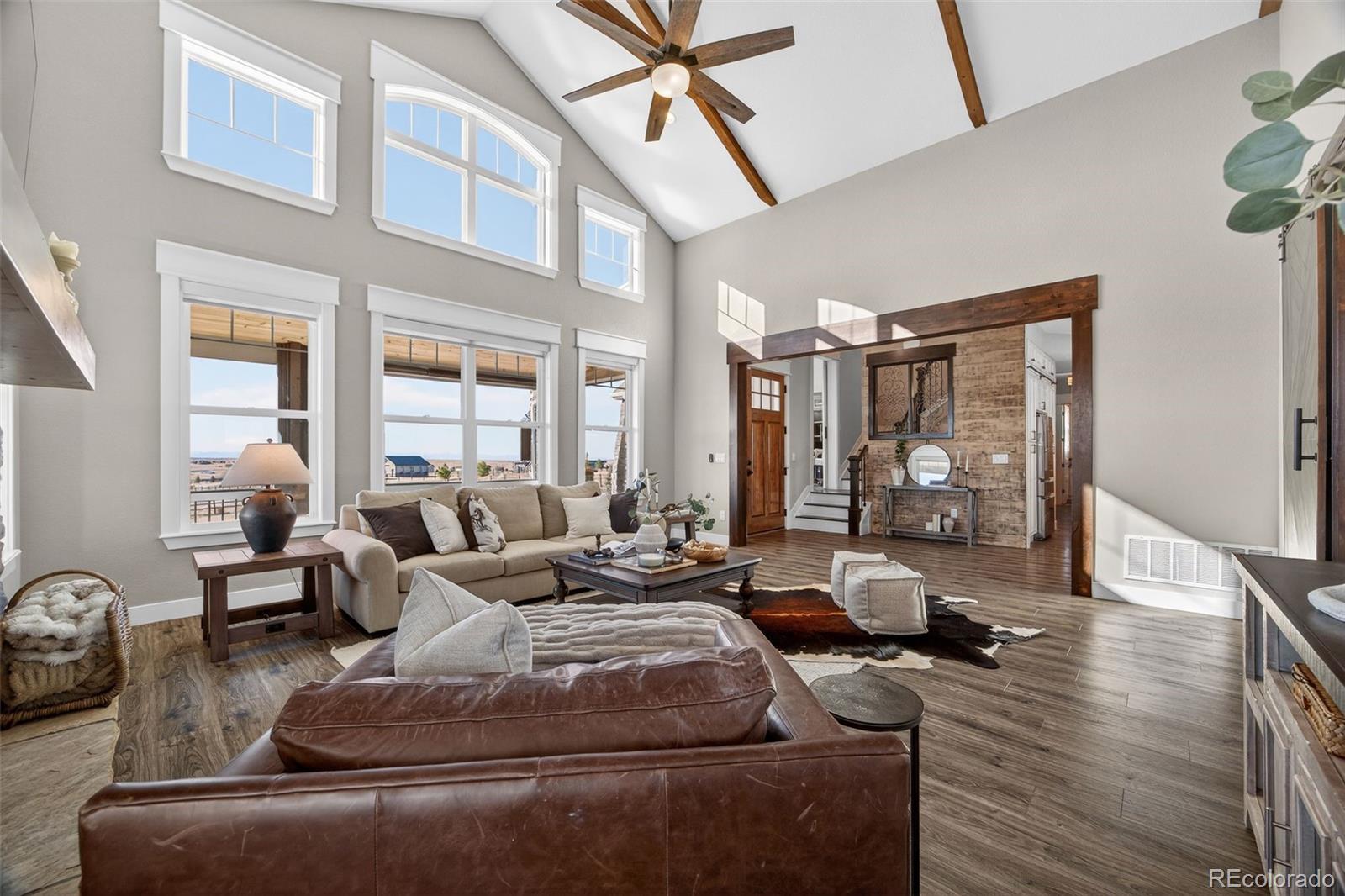 3444 Antelope Ridge Trail Parker, CO 80138 - Photo 10 of 50 a living room with furniture and wooden floor