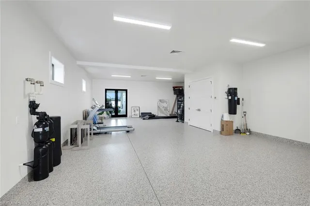 an entryway with wooden floor and stairs