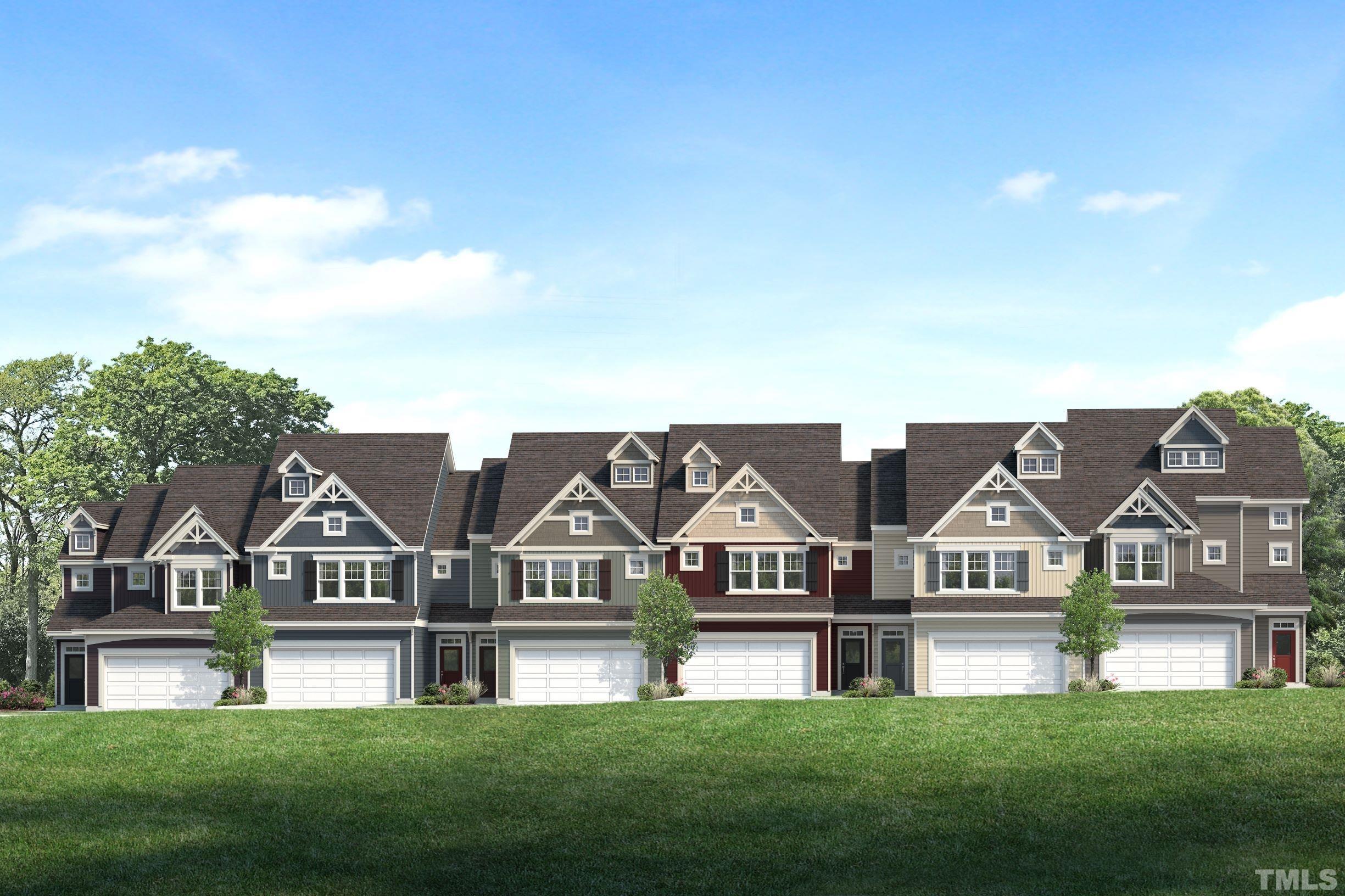 a view of a big house with a big yard and large trees