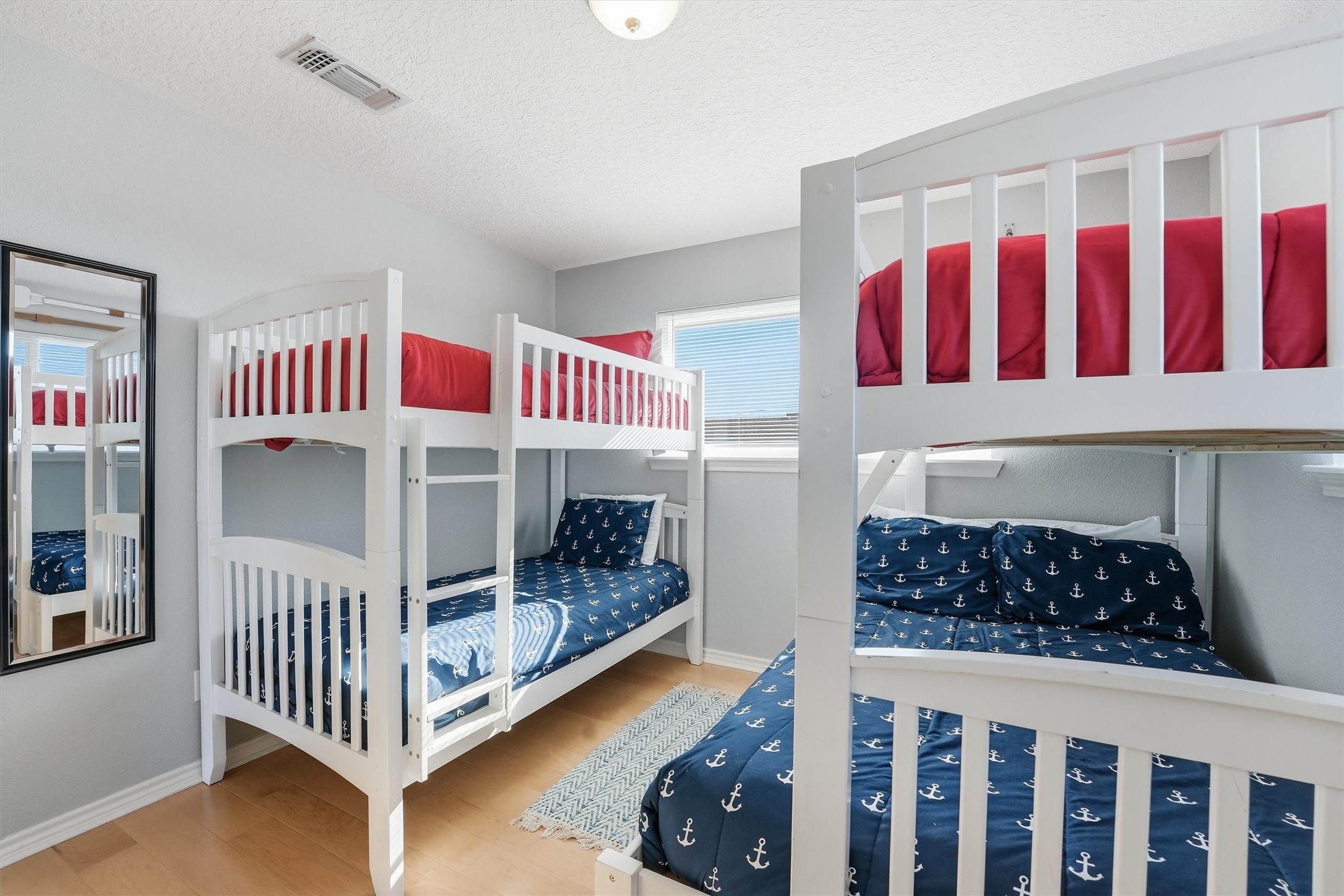 12902 John Reynolds Road Galveston, TX 77554 - Photo 16 of 22 a bedroom with a bed and a window