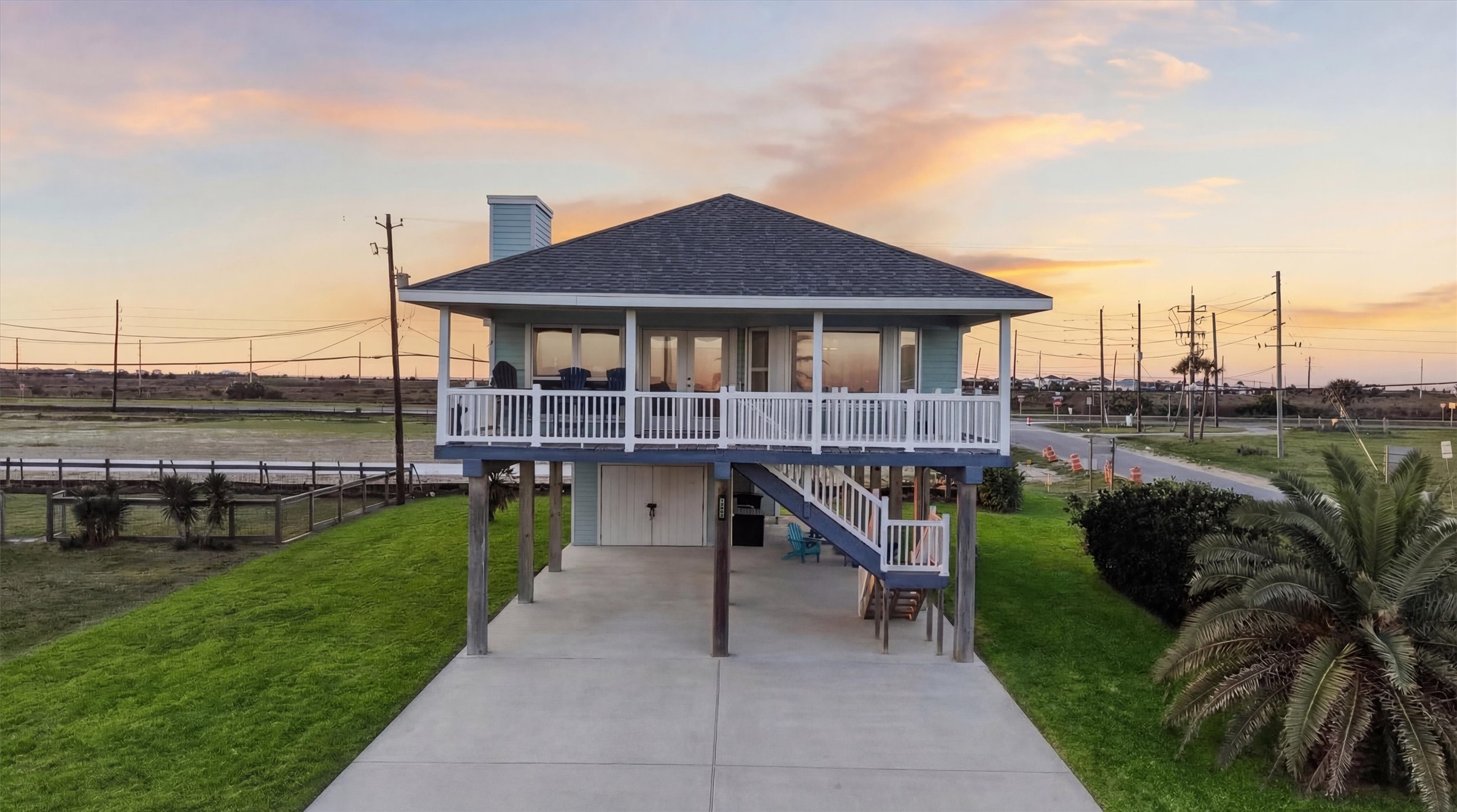 12902 John Reynolds Road Galveston, TX 77554 - Photo 2 of 22 a view of a house with a yard
