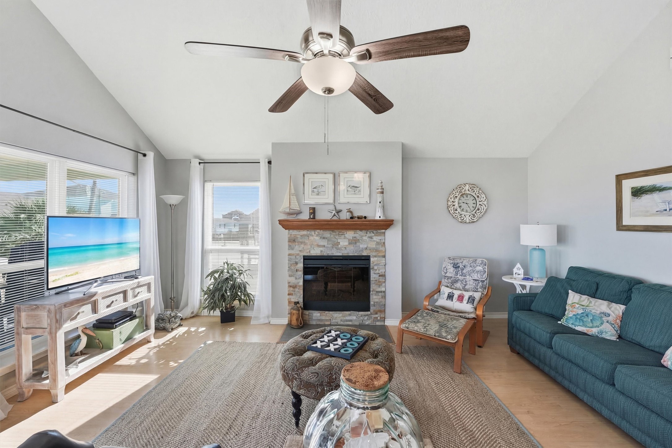 12902 John Reynolds Road Galveston, TX 77554 - Photo 3 of 22 a living room with furniture and a fireplace