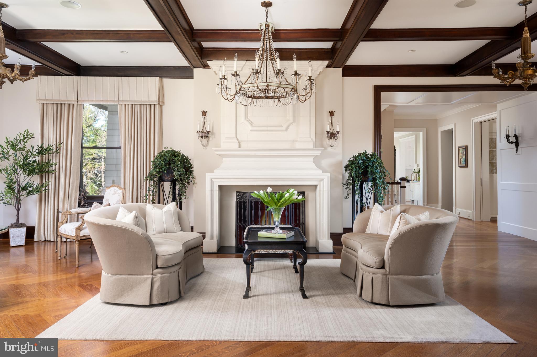 3031 Gates Road Northwest Washington, DC 20008 - Photo 11 of 50 a living room with furniture a chandelier and a fireplace