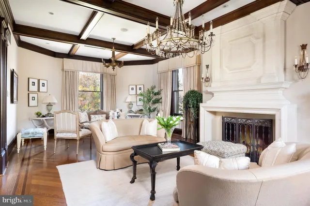 a living room with patio furniture and a fireplace