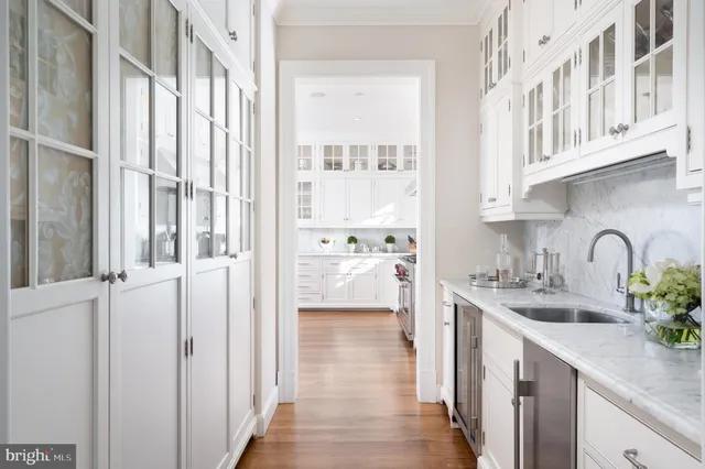 a view of a kitchen with a sink and windows