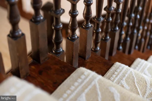 a spacious bedroom with a bed and wooden floor