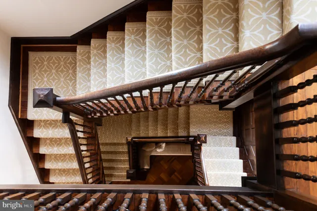 a bedroom with a bed and a table in it