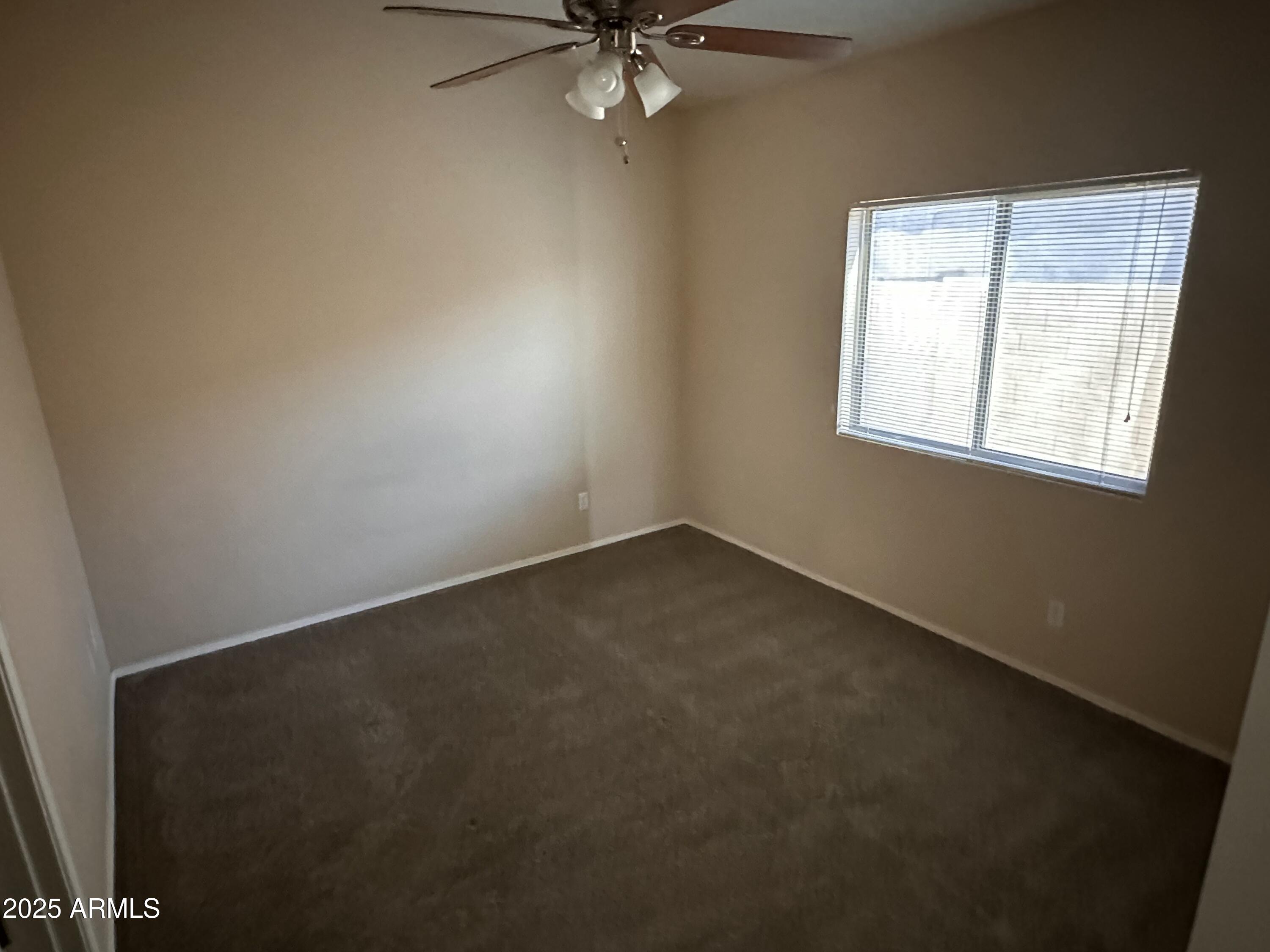 25412 North 40th Lane Phoenix, AZ 85083 - Photo 11 of 19 an empty room with a window