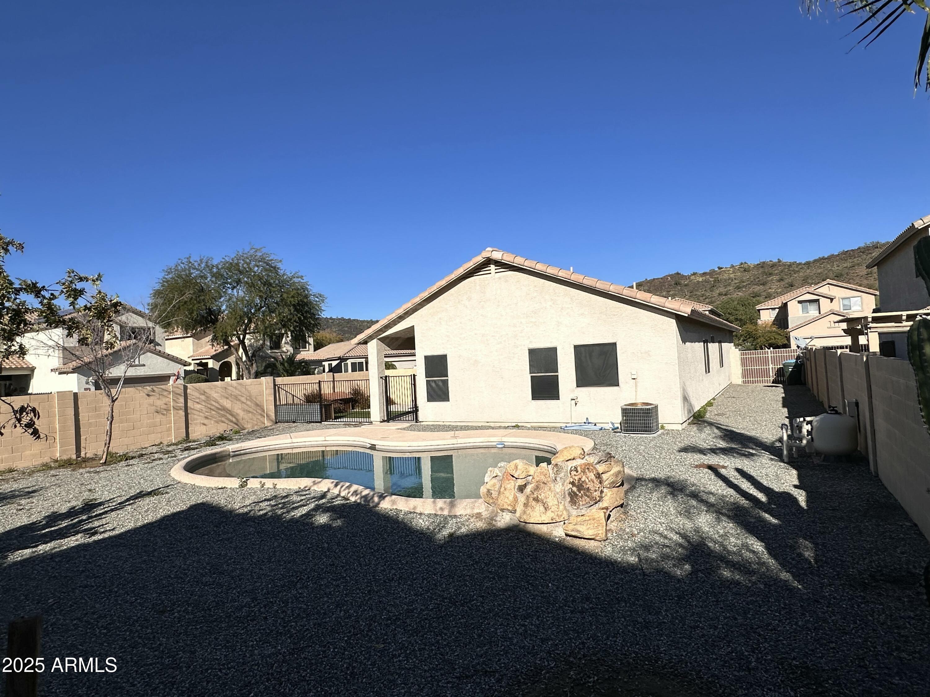 25412 North 40th Lane Phoenix, AZ 85083 - Photo 18 of 19 a front view of a house with a yard