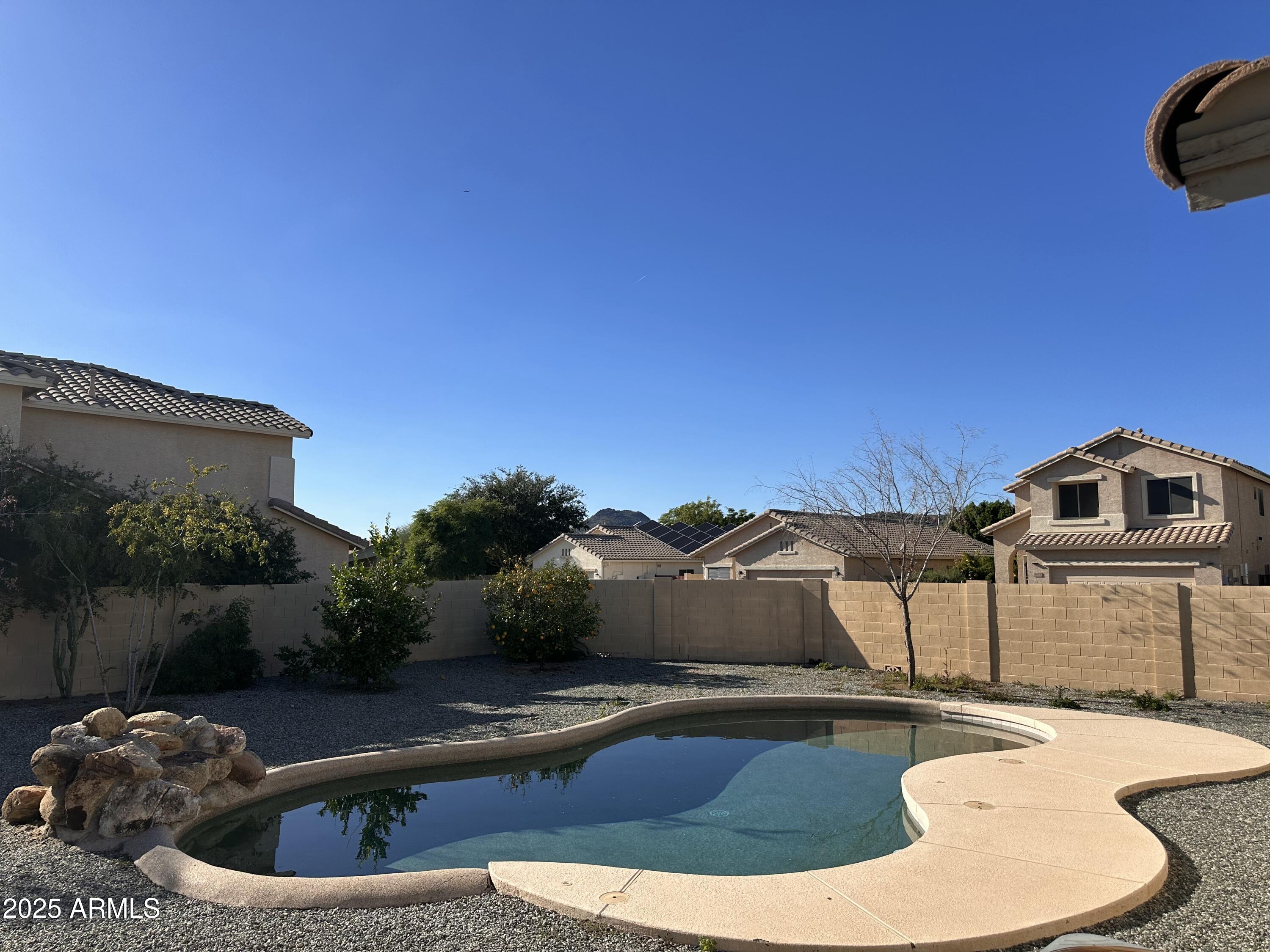 25412 North 40th Lane Phoenix, AZ 85083 - Photo 2 of 19 a view of a swimming pool with a yard