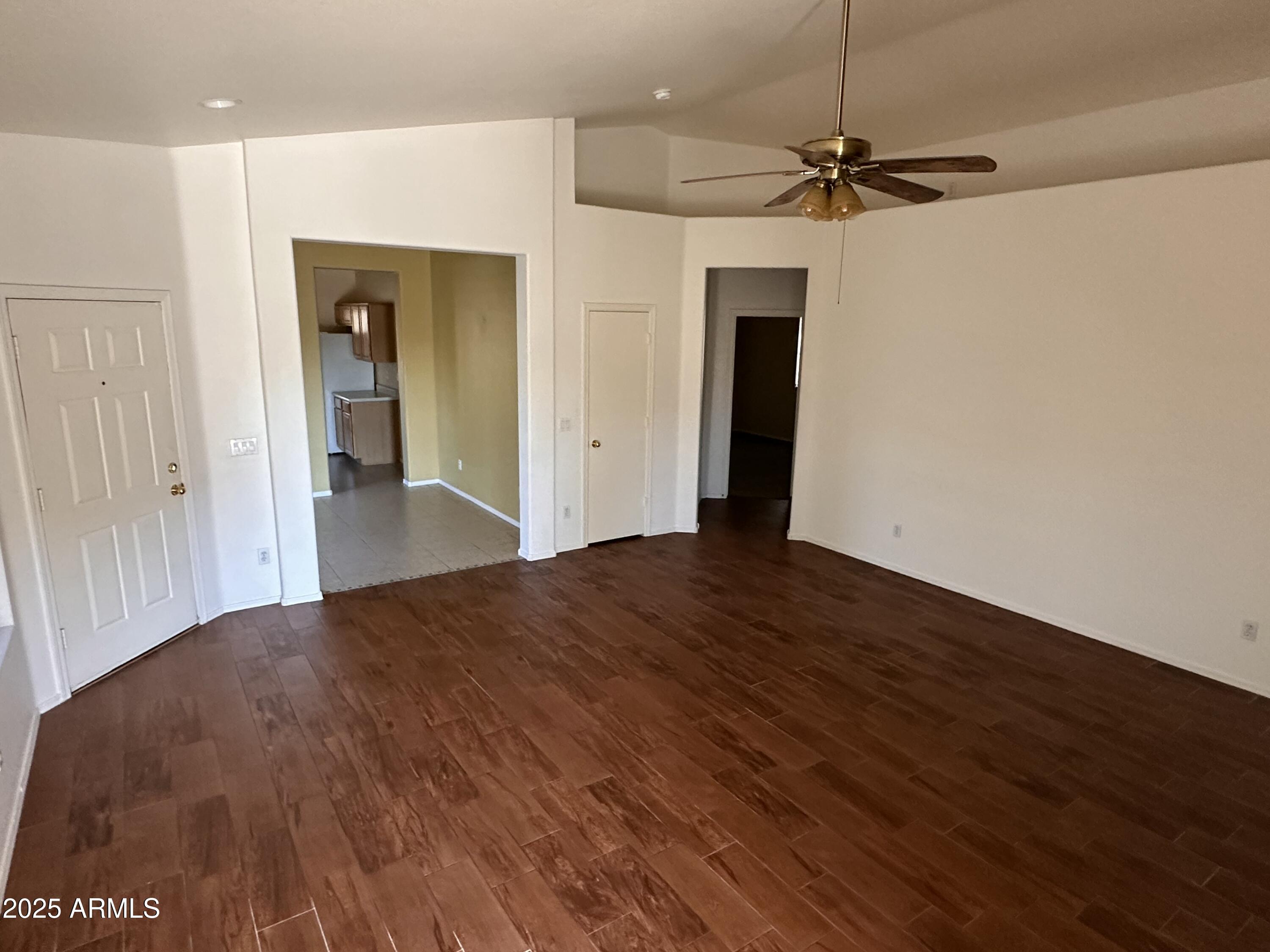 25412 North 40th Lane Phoenix, AZ 85083 - Photo 4 of 19 a view of a room with wooden floor a ceiling fan