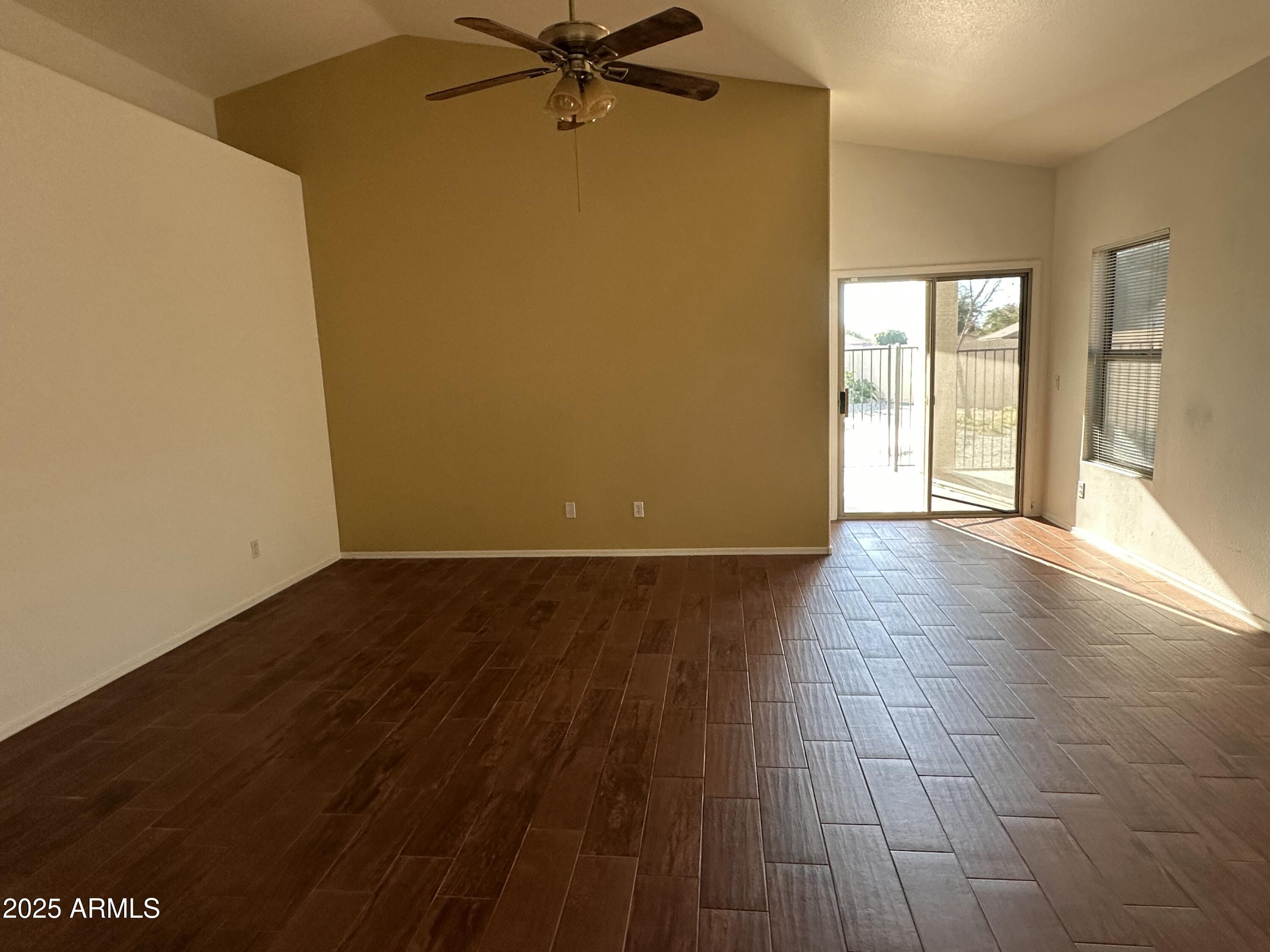 25412 North 40th Lane Phoenix, AZ 85083 - Photo 8 of 19 wooden floor in an empty room with a window