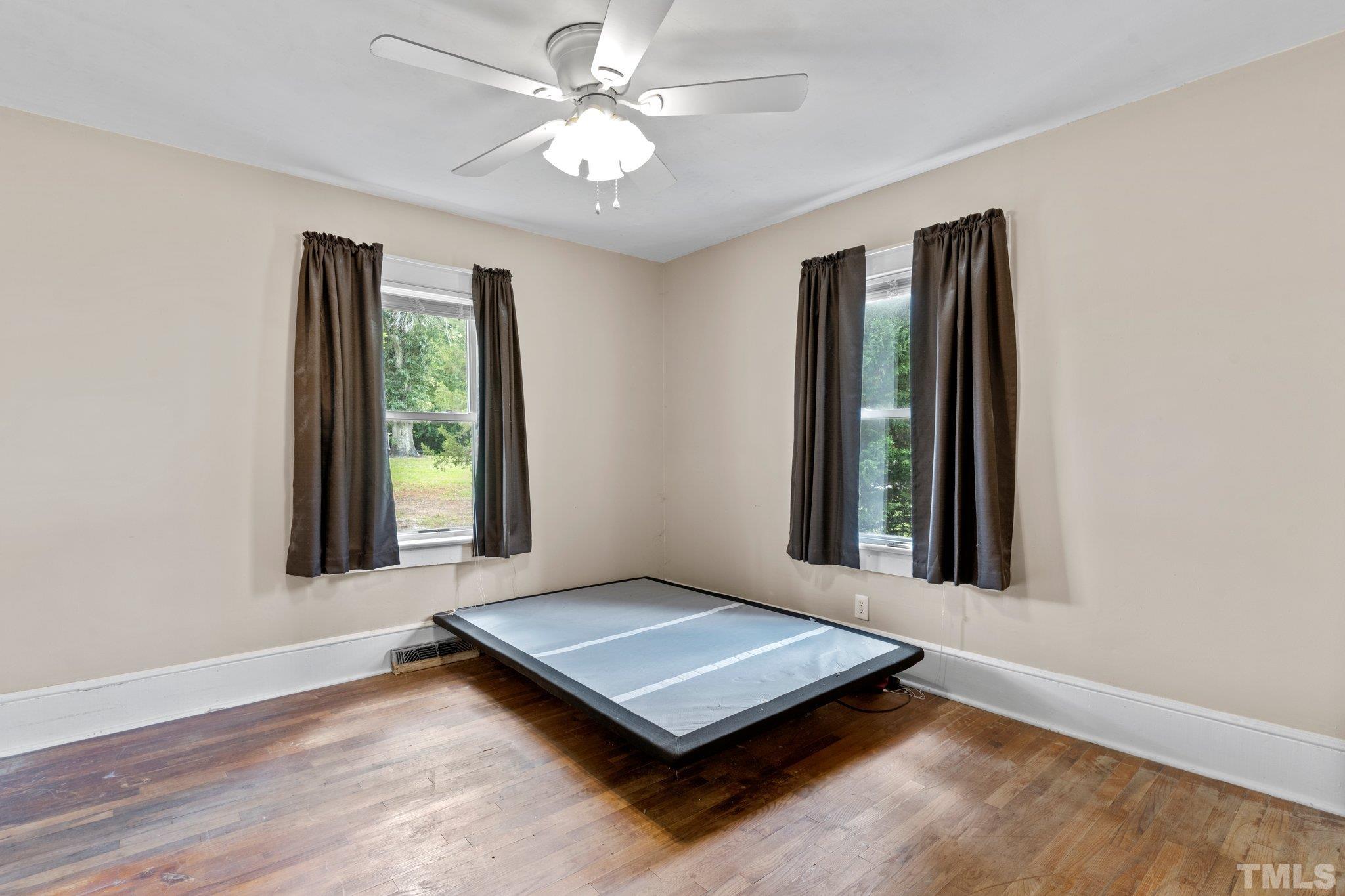 218 Oxford Road Roxboro, NC 27573 - Photo 7 of 16 a living room with window and ceiling fan