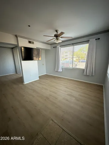 a view of an empty room with a window