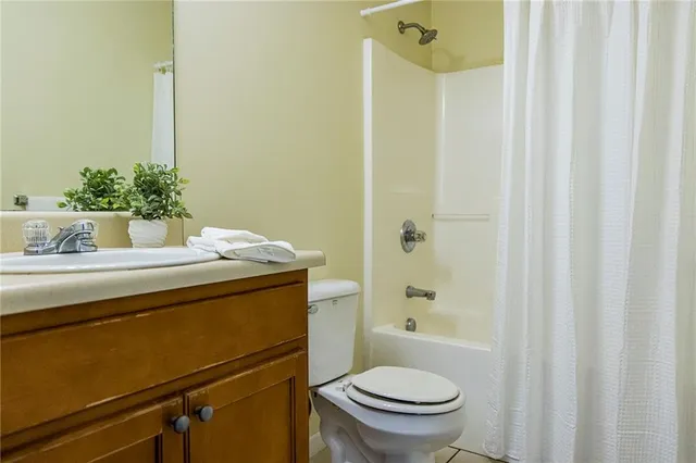 a view of a bathroom with a sink and a mirror
