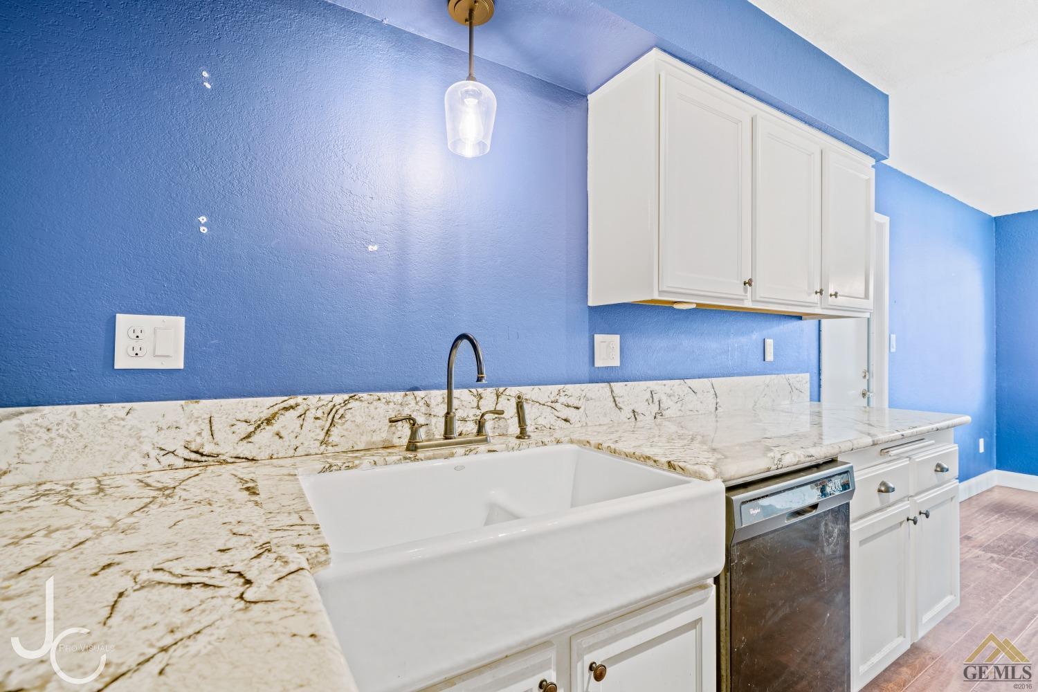 Undisclosed Address Bakersfield, CA 93308 - Photo 3 of 14 a bathroom with a sink and cabinets
