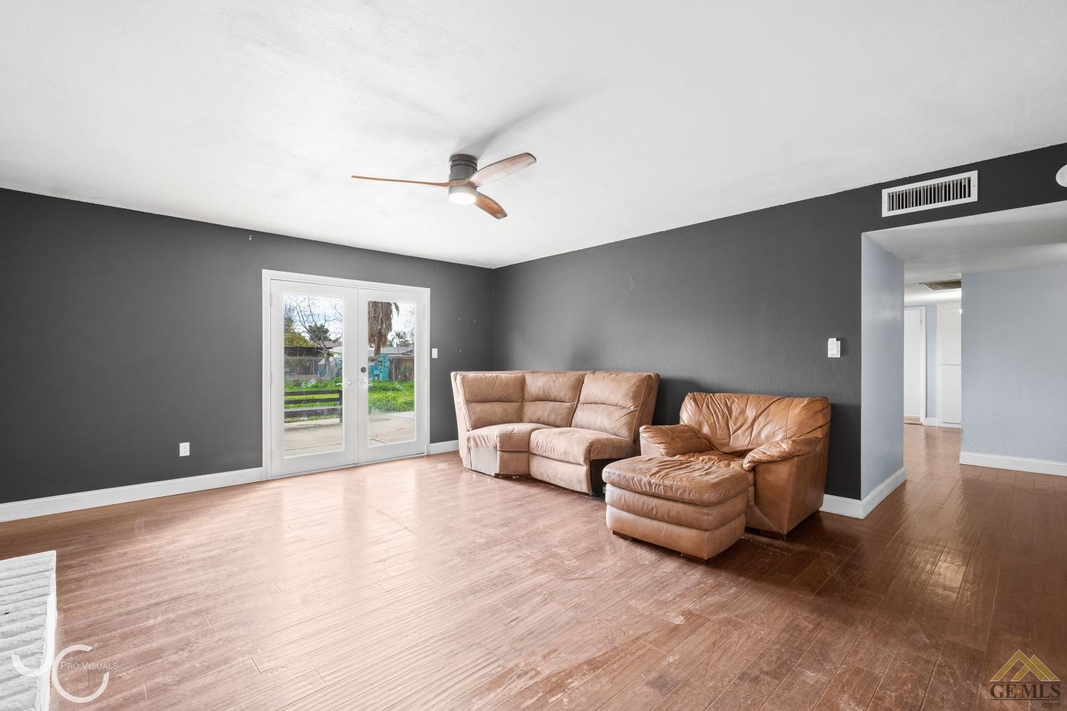 Undisclosed Address Bakersfield, CA 93308 - Photo 6 of 14 a living room with furniture and a large window