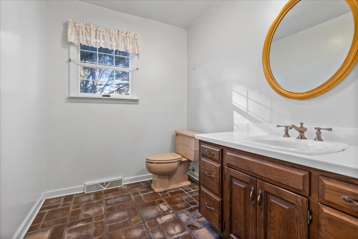 1107 Pine Ridge Court Normal, IL 61761 - Photo 13 of 50 a bathroom with a sink and a mirror