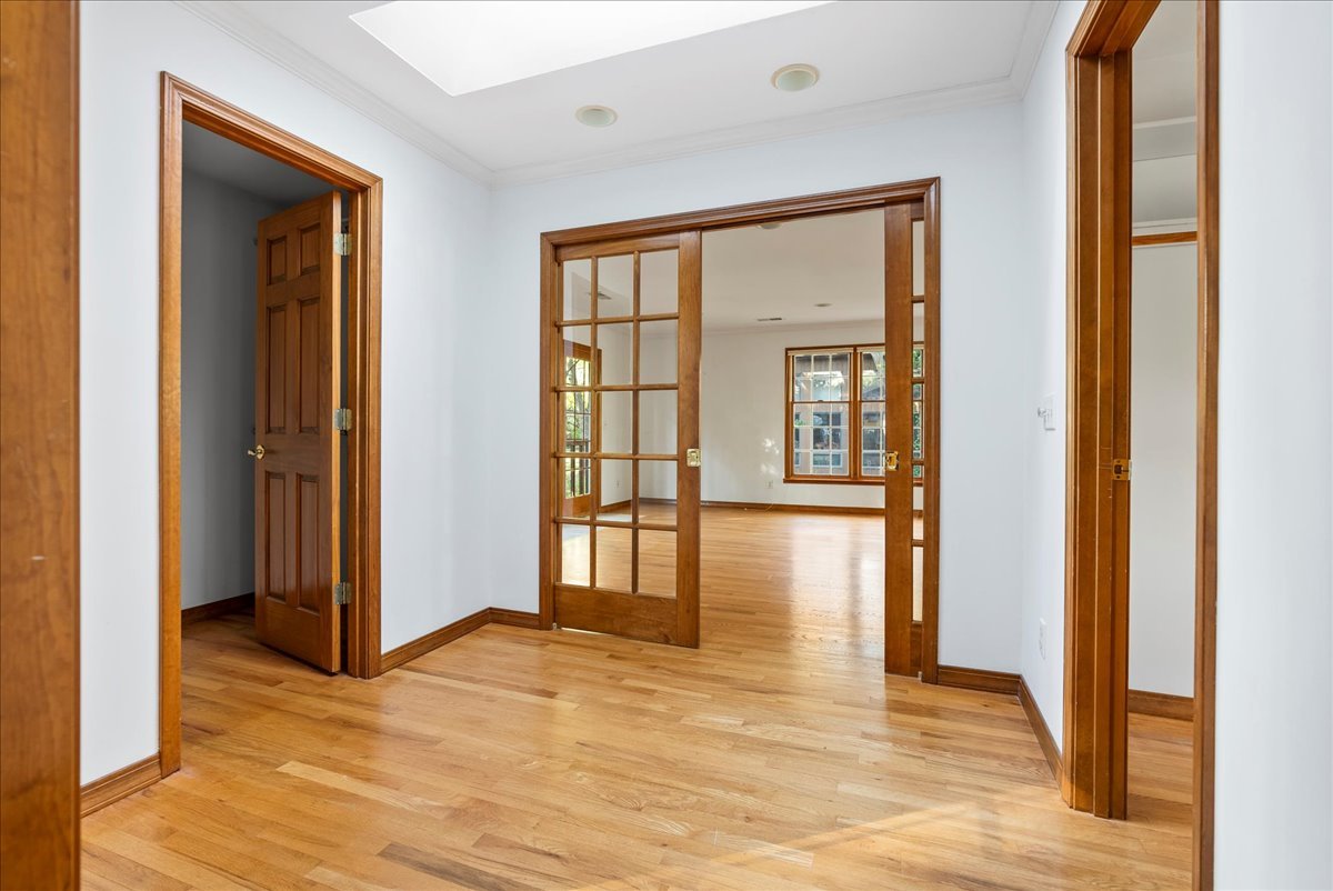 1107 Pine Ridge Court Normal, IL 61761 - Photo 22 of 50 a view of empty room with wooden floor and floor to ceiling window