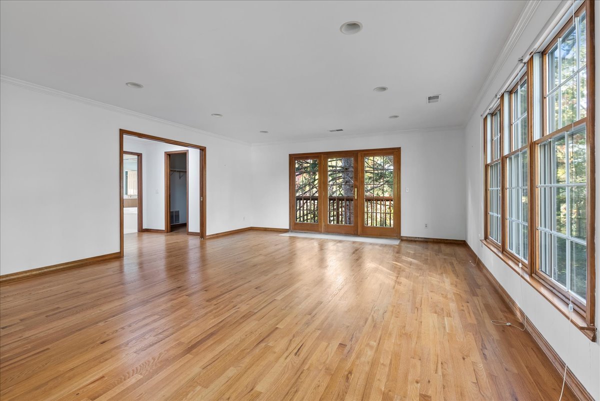 1107 Pine Ridge Court Normal, IL 61761 - Photo 24 of 50 wooden floor in an empty room with a window