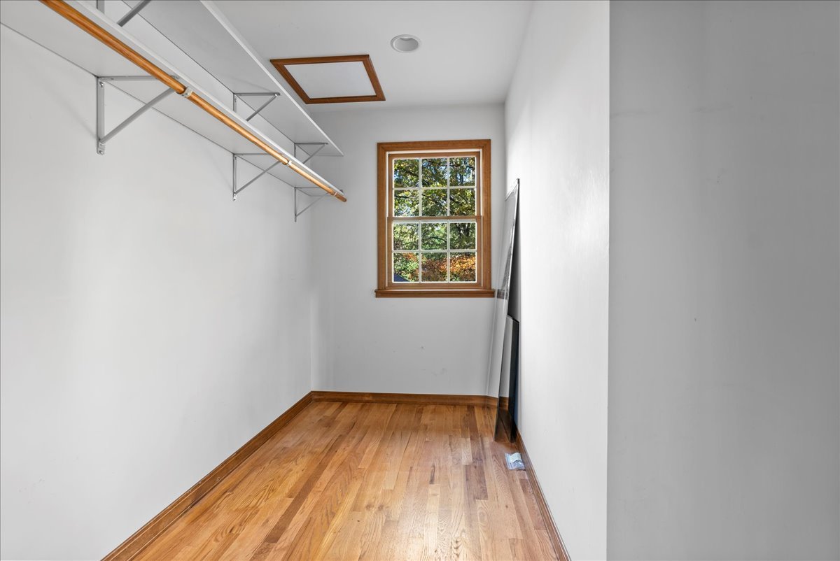 1107 Pine Ridge Court Normal, IL 61761 - Photo 26 of 50 a view of a hallway with wooden floor and a window