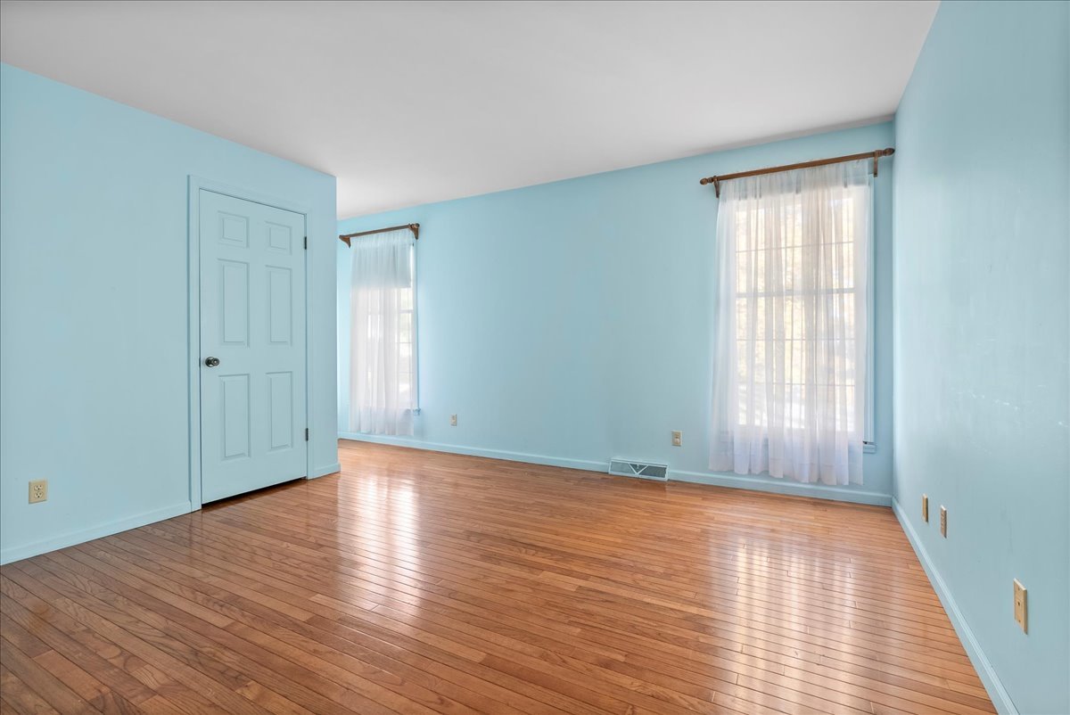 1107 Pine Ridge Court Normal, IL 61761 - Photo 31 of 50 a view of an empty room with wooden floor and a window