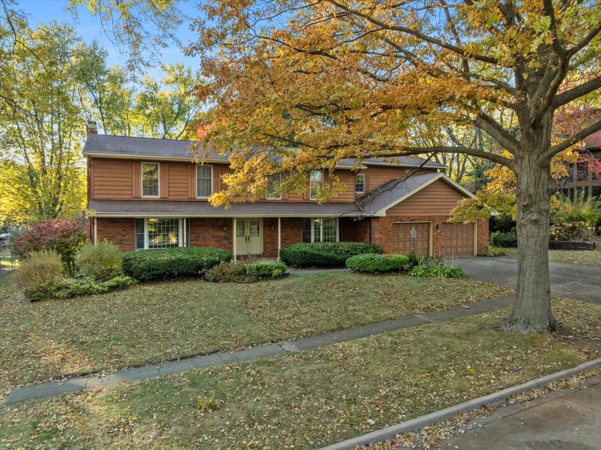 1107 Pine Ridge Court Normal, IL 61761 - Photo 46 of 50 a front view of a house with a yard and garage