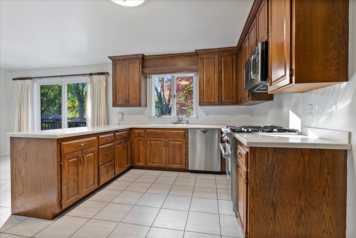 1107 Pine Ridge Court Normal, IL 61761 - Photo 10 of 50 a kitchen with a sink cabinets and window