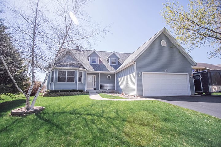 110 Pembroke Road Southwest Poplar Grove, IL 61065 - Photo 1 of 25 a front view of house with yard and green space