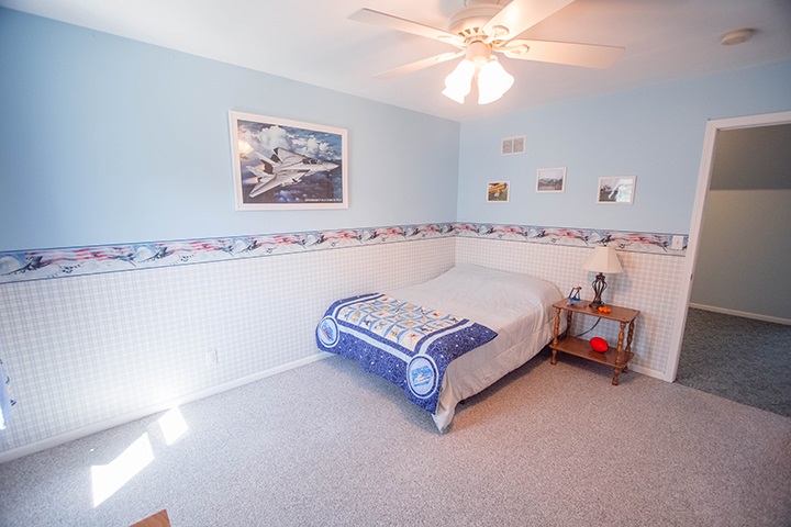 110 Pembroke Road Southwest Poplar Grove, IL 61065 - Photo 12 of 25 a spacious bedroom with a bed and a chandelier