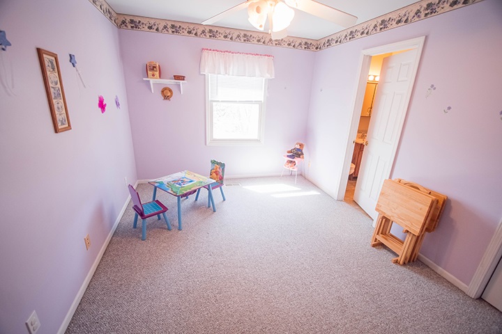 110 Pembroke Road Southwest Poplar Grove, IL 61065 - Photo 14 of 25 a living room with furniture and a window