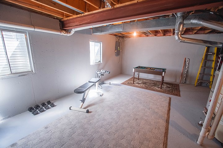 110 Pembroke Road Southwest Poplar Grove, IL 61065 - Photo 17 of 25 a room with gym equipment and a mirror